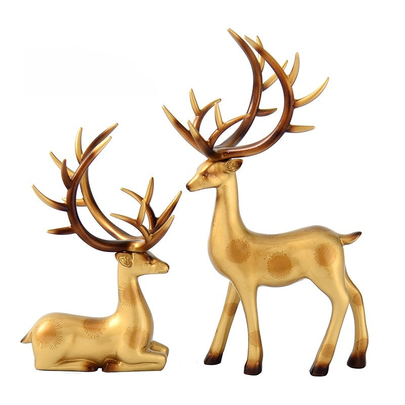 Deer statues in standing and reclining positions