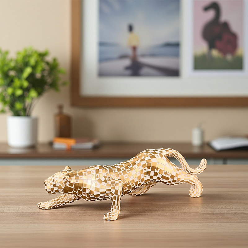 Gold-colored resin leopard ornament