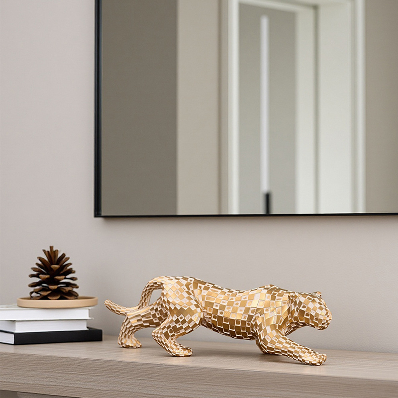 Gold-colored resin leopard ornament