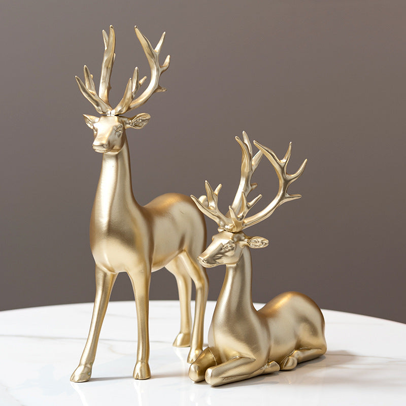 Deer statues in standing and reclining positions