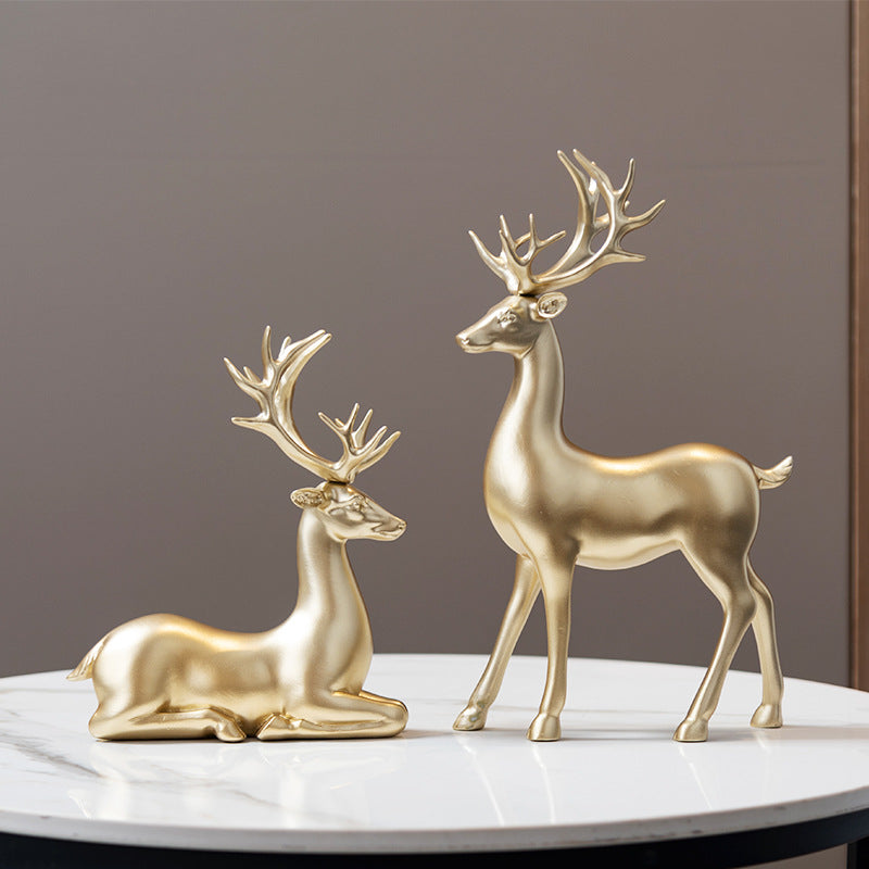 Deer statues in standing and reclining positions
