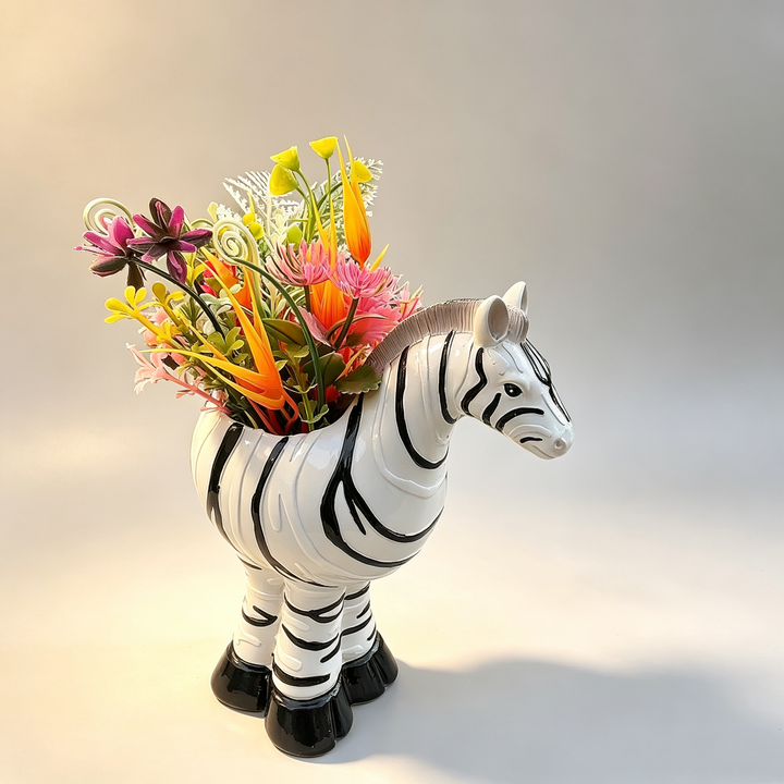 Footed planter with zebra-stripe pattern